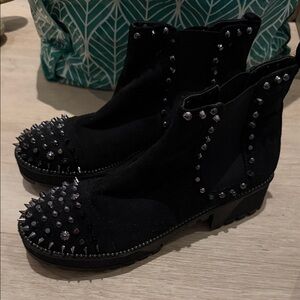 Black boots with spike detailing adorable on, so chic